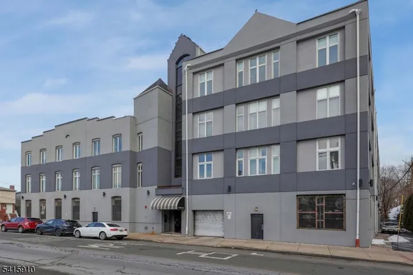 a front view of a building with lot of windows