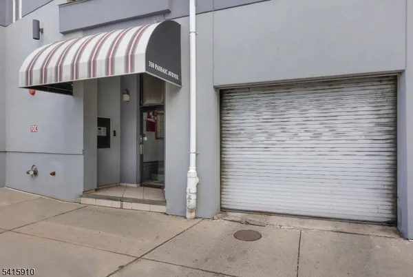 a view of a house with entryway and wooden walls