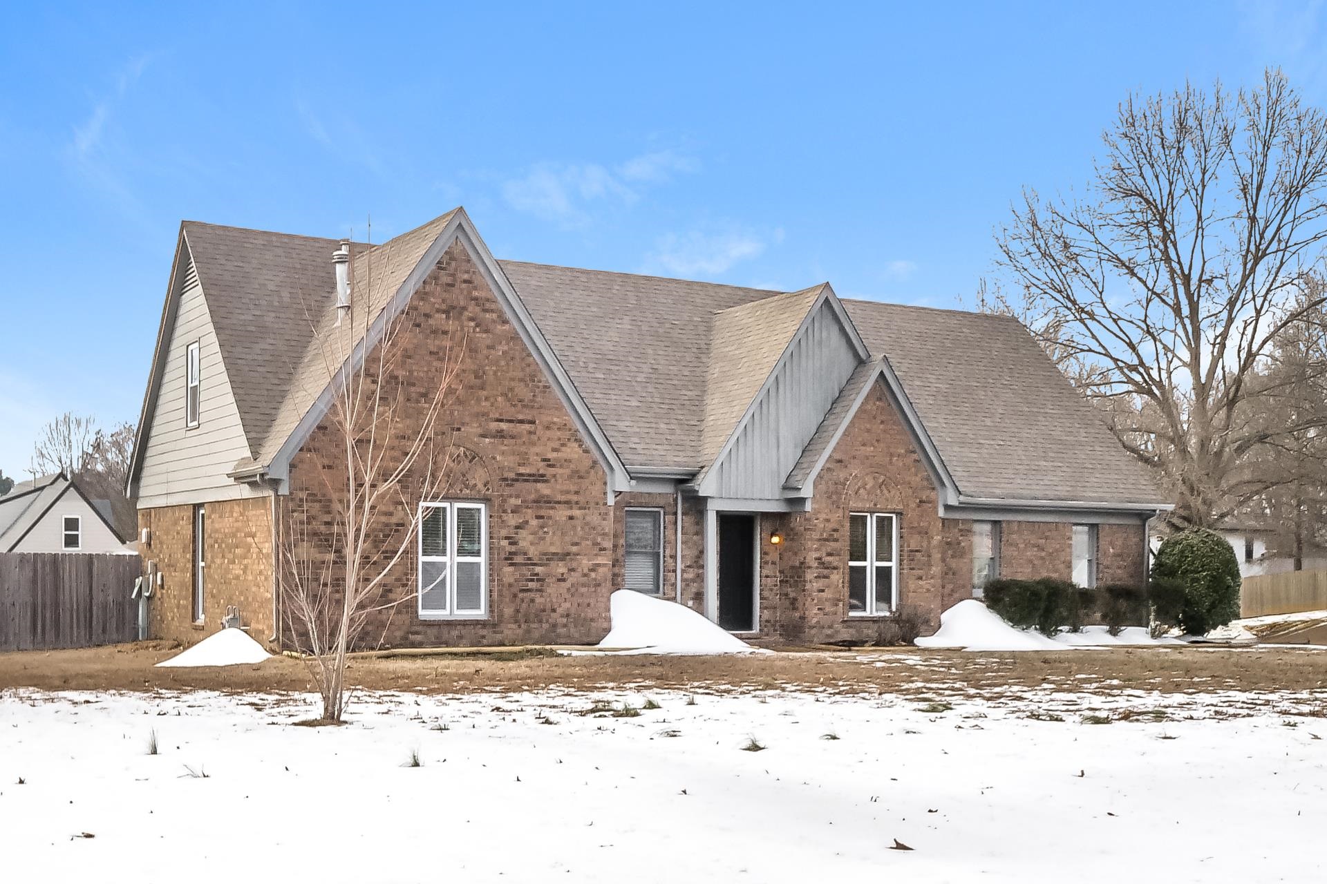 View of front of home featuring brick siding