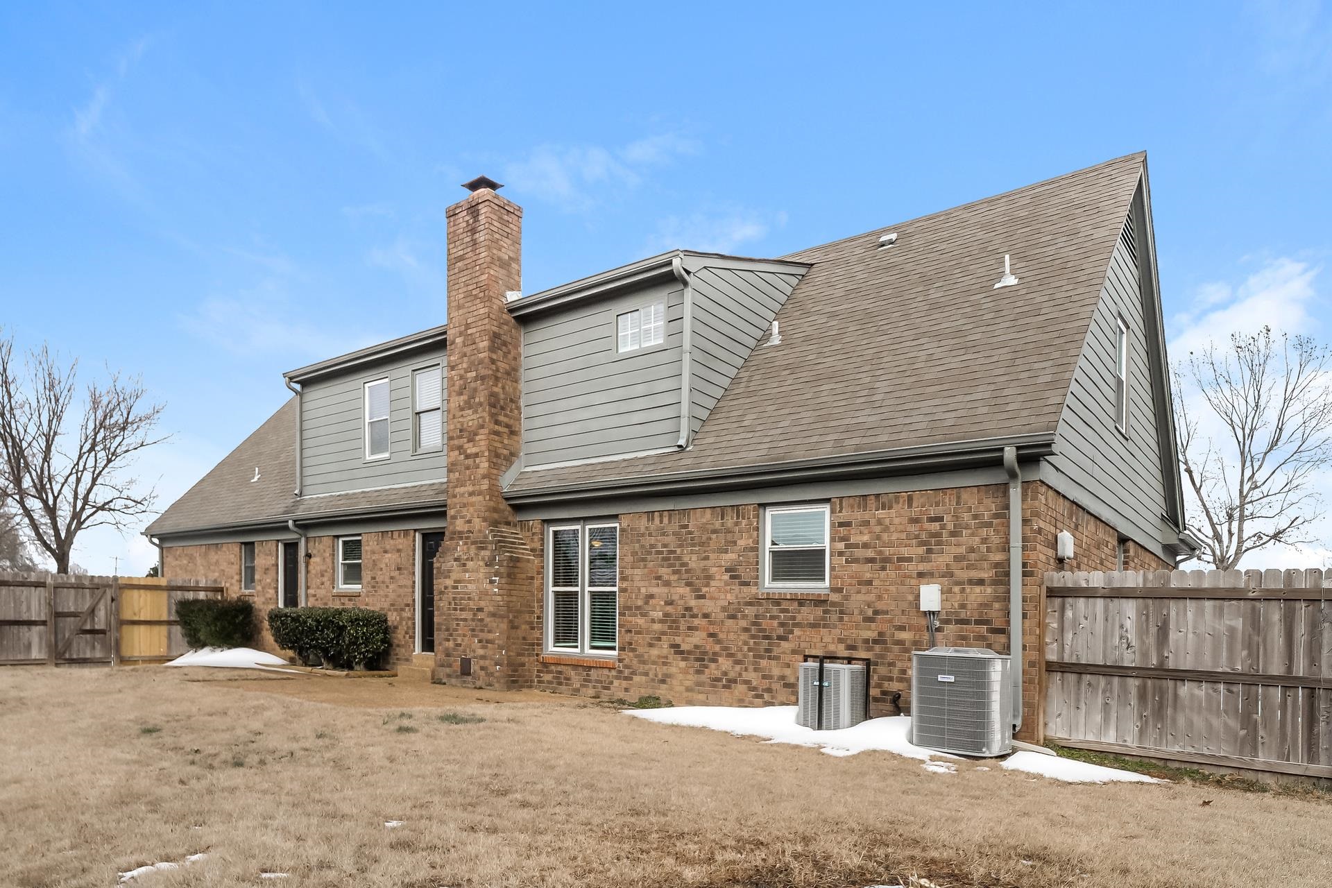 675 South Collierville Arlington Road Collierville, TN 38017 - Photo 14 of 17 Rear view of property with brick siding, a chimney, a gate, and a shingled roof
