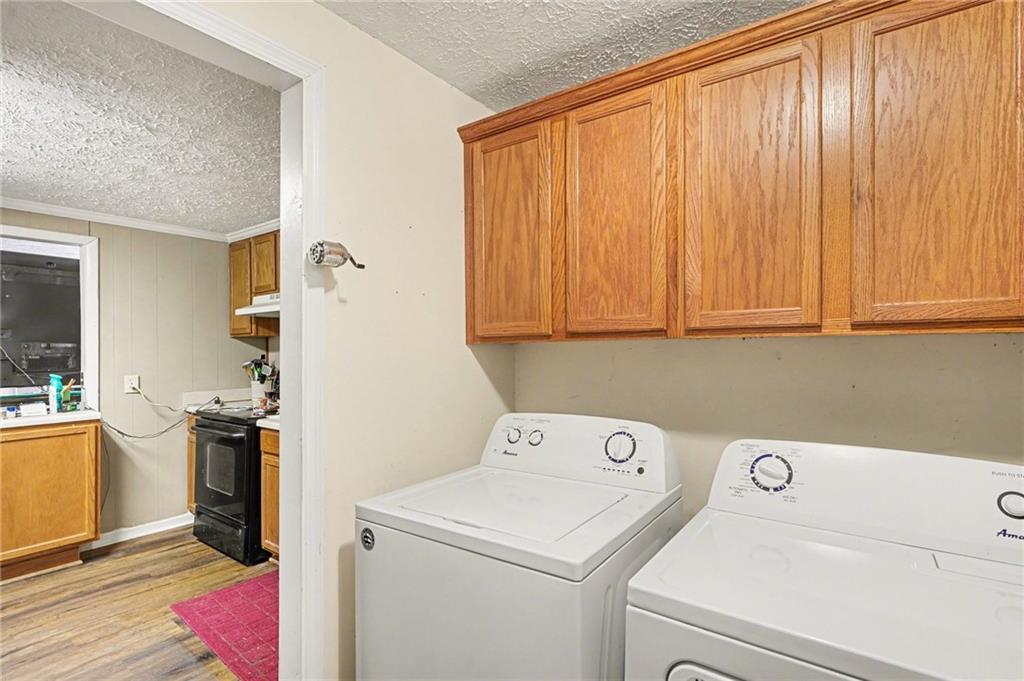 137 Taylor Road Jackson, GA 30233 - Photo 12 of 23 a view of storage and utility room with washer and dryer