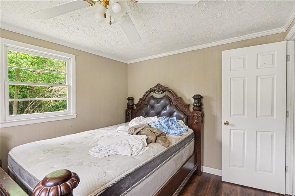 137 Taylor Road Jackson, GA 30233 - Photo 14 of 23 a bed sitting in a bedroom next to a window