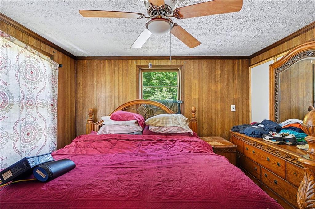 137 Taylor Road Jackson, GA 30233 - Photo 15 of 23 a bedroom with a large bed and a window