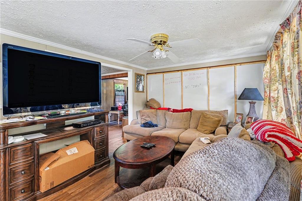 137 Taylor Road Jackson, GA 30233 - Photo 5 of 23 a living room with furniture and a flat screen tv