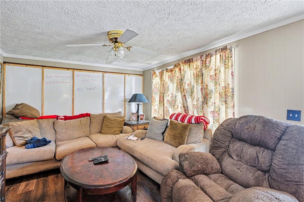 137 Taylor Road Jackson, GA 30233 - Photo 6 of 23 a living room with furniture and a large window