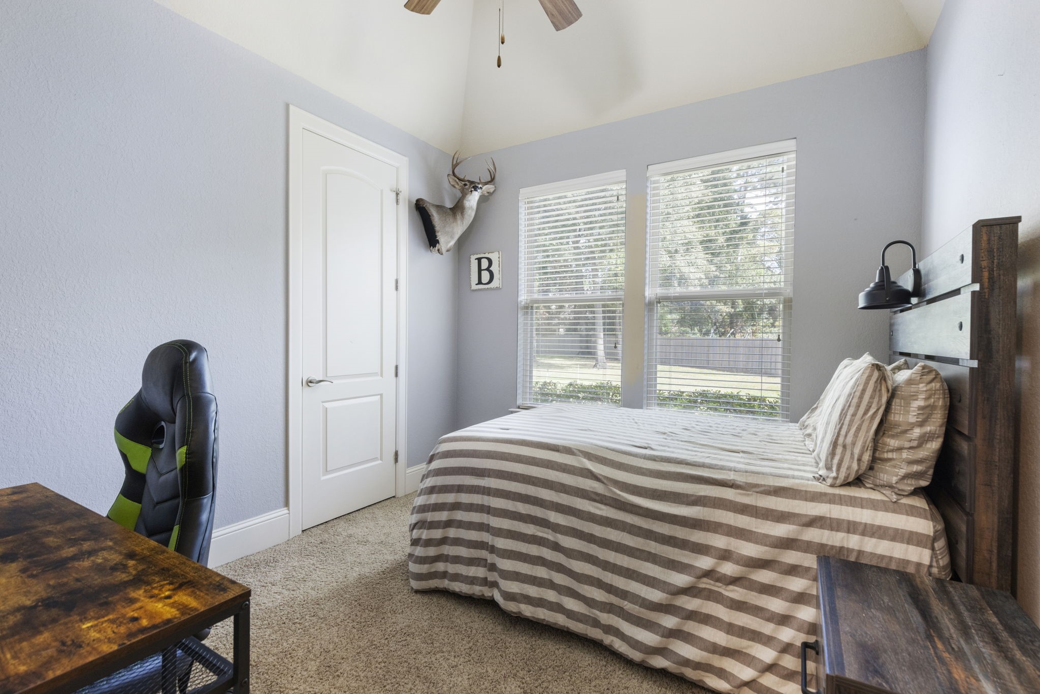 4103 Tee Tree Court Spring, TX 77386 - Photo 19 of 37 Comfortable Secondary Bedroom with an elevated ceiling, ceiling fan, and carpet.