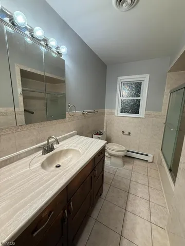 a bathroom with a sink double vanity and a mirror