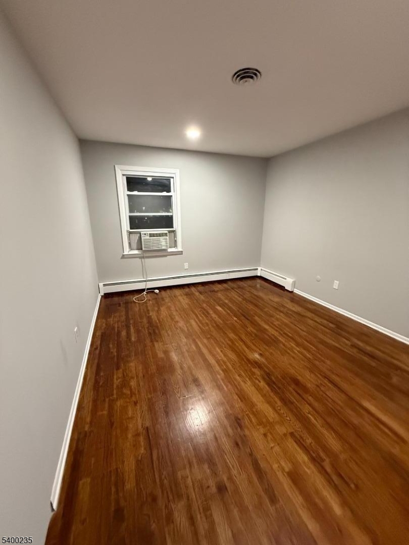 116 West Linden Avenue Linden, NJ 07036 - Photo 8 of 9 a view of room with window and wooden floor