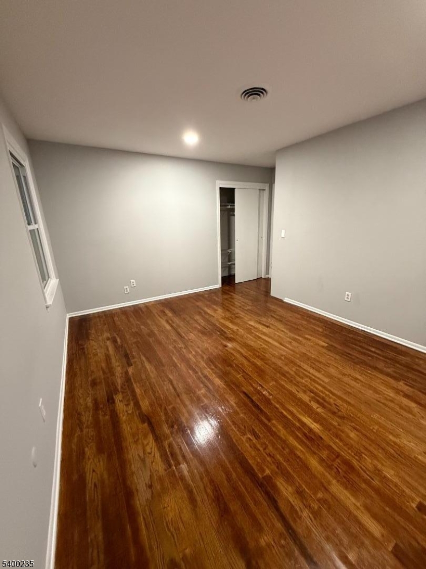 116 West Linden Avenue Linden, NJ 07036 - Photo 9 of 9 a view of empty room with wooden floor