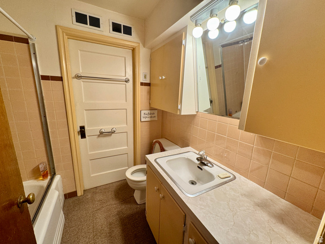 178 Walnut Lane Moab, UT 84532 - Photo 16 of 25 Bathroom featuring a built-in vanity with laminate countertop, integrated sink, and medicine cabinet with vanity lighting