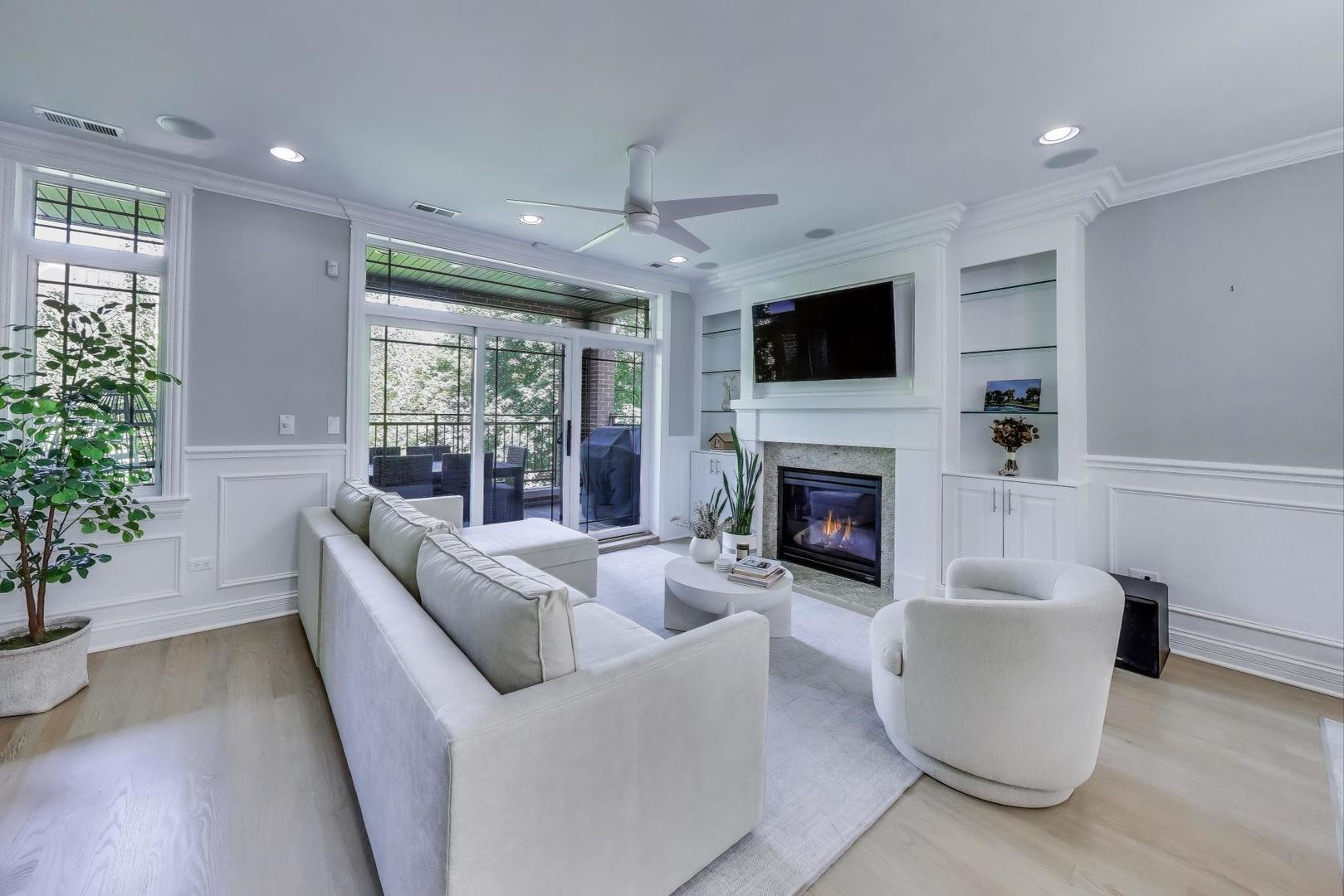 735 West Brompton Avenue, Unit 2E Chicago, IL 60657 - Photo 11 of 25 a living room with furniture fireplace and potted plant