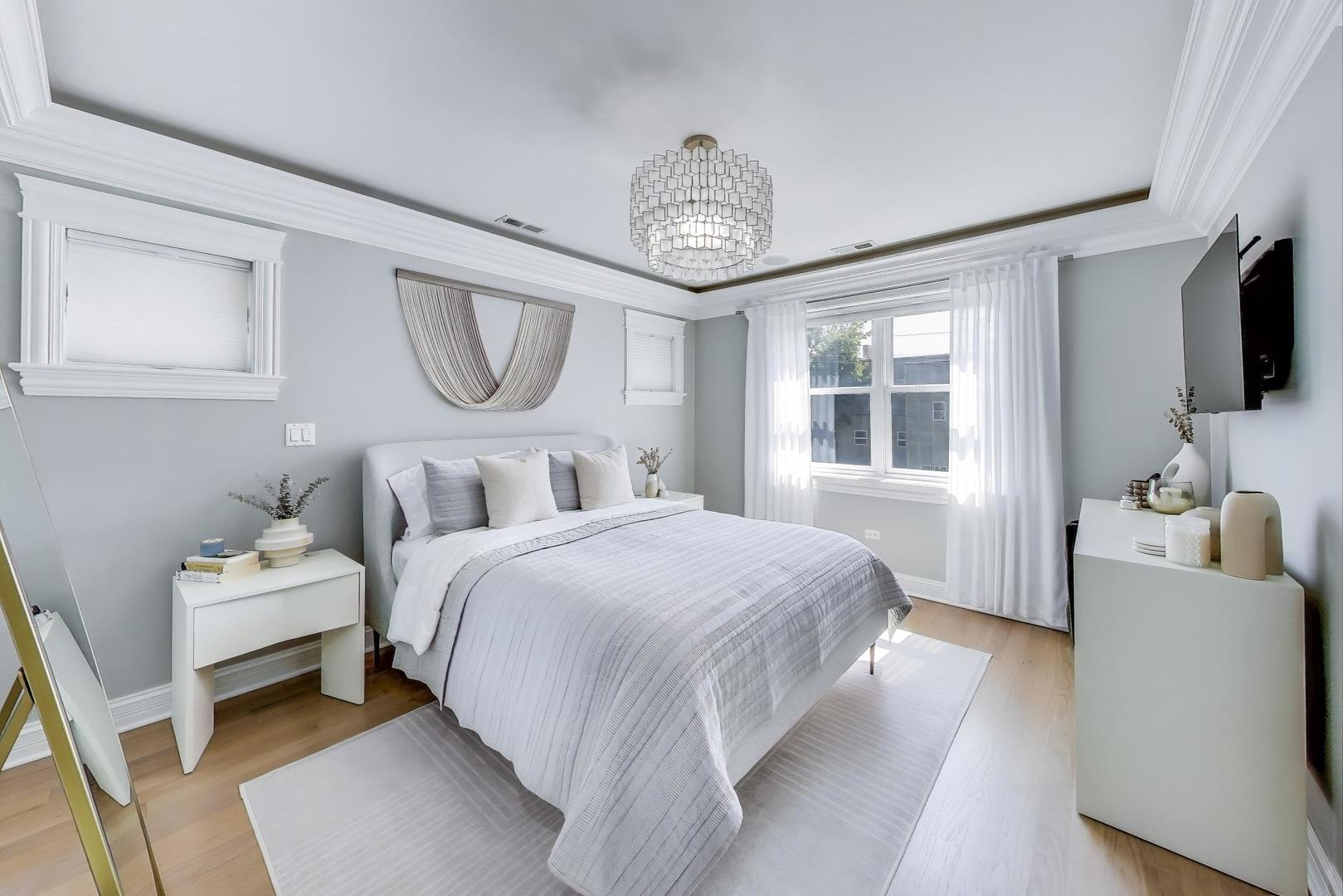 735 West Brompton Avenue, Unit 2E Chicago, IL 60657 - Photo 15 of 25 a bedroom with bed and a window