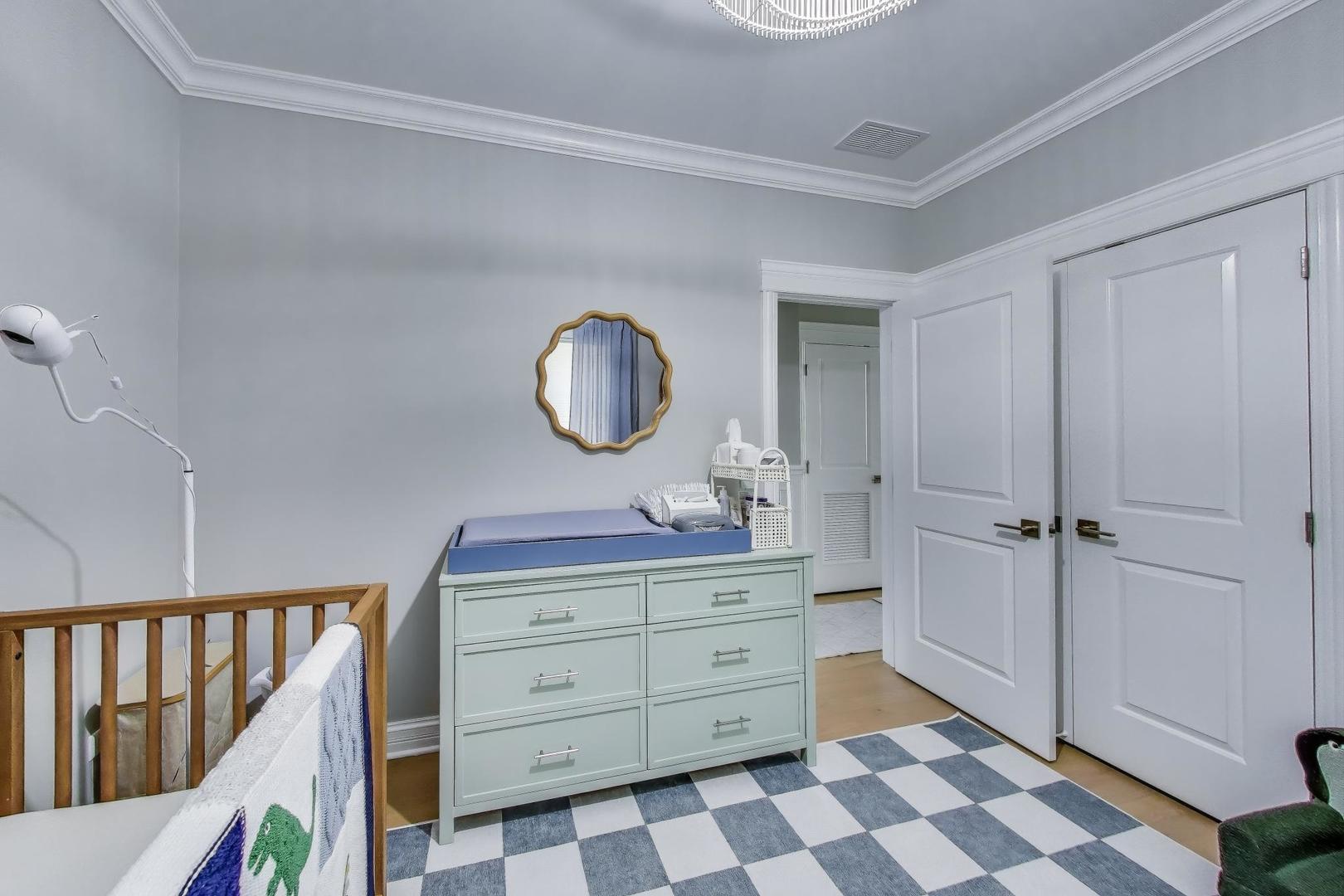 735 West Brompton Avenue, Unit 2E Chicago, IL 60657 - Photo 19 of 25 a room with a dresser and a mirror