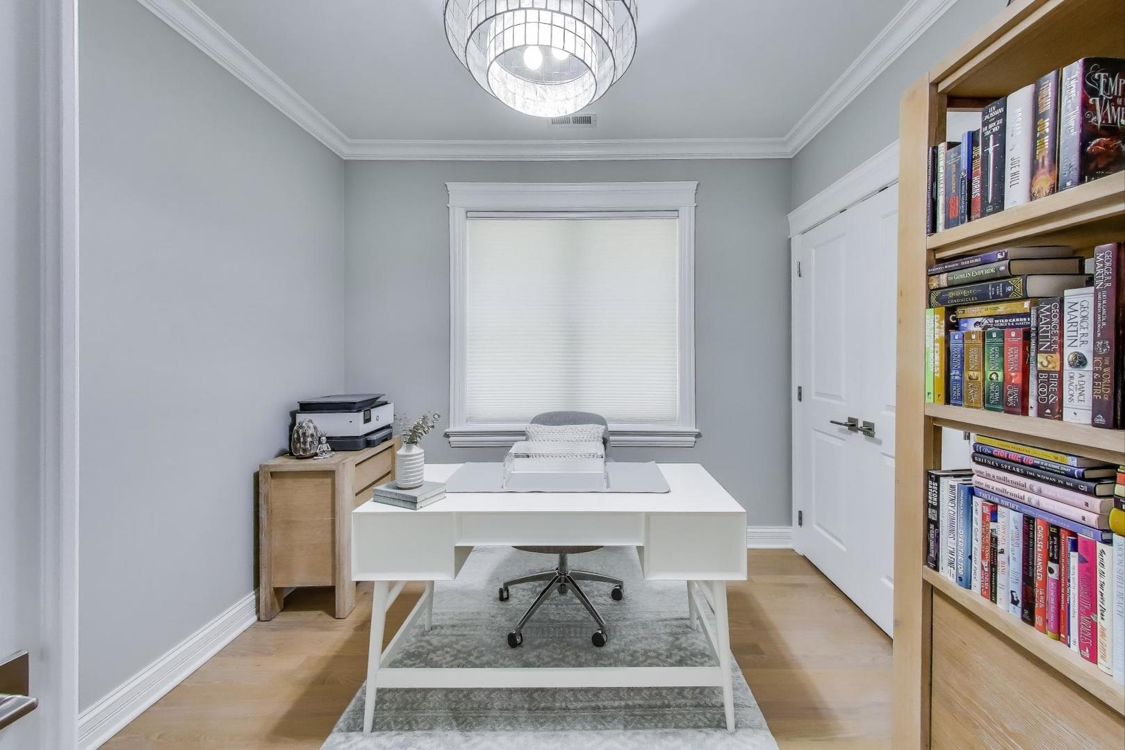 735 West Brompton Avenue, Unit 2E Chicago, IL 60657 - Photo 20 of 25 a living room with chair and a book shelf
