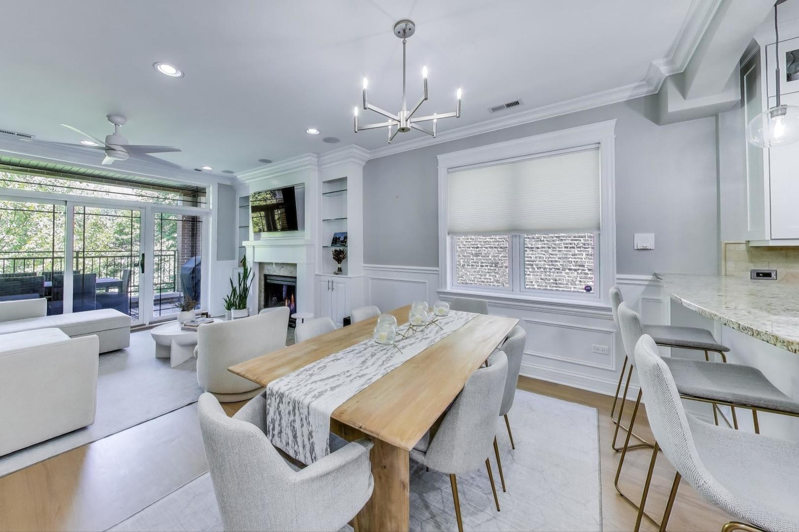 735 West Brompton Avenue, Unit 2E Chicago, IL 60657 - Photo 3 of 25 a view of a dining room with furniture window and outside view