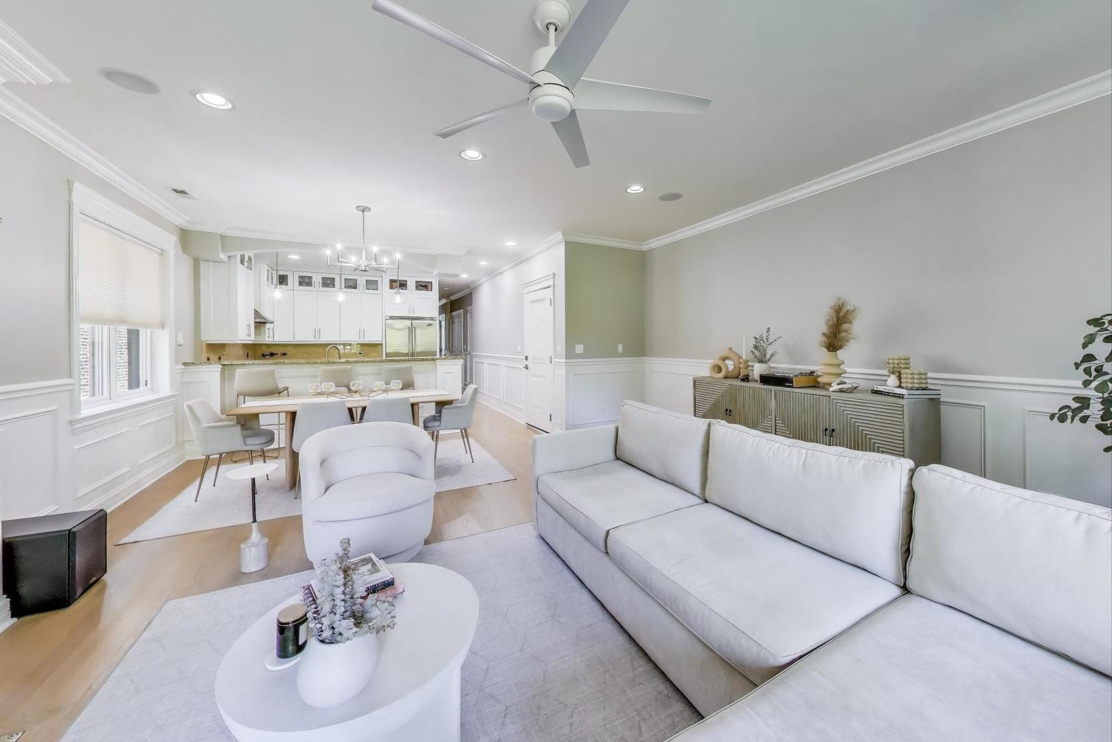 735 West Brompton Avenue, Unit 2E Chicago, IL 60657 - Photo 5 of 25 a living room with furniture kitchen view and a wooden floor