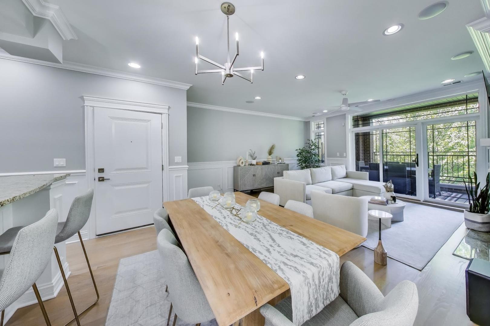 735 West Brompton Avenue, Unit 2E Chicago, IL 60657 - Photo 9 of 25 a living room with furniture and a large window