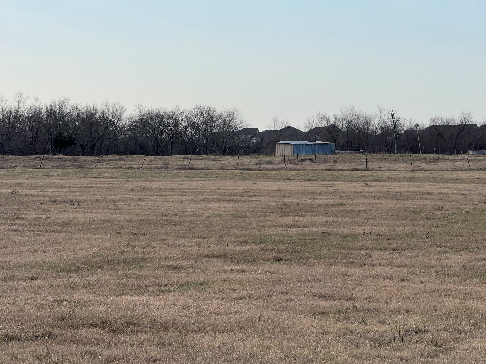 14831 Bois-D-Arc Road, Unit 10 Manor, TX 78653 - Photo 16 of 17 View of yard featuring a rural view and an outbuilding