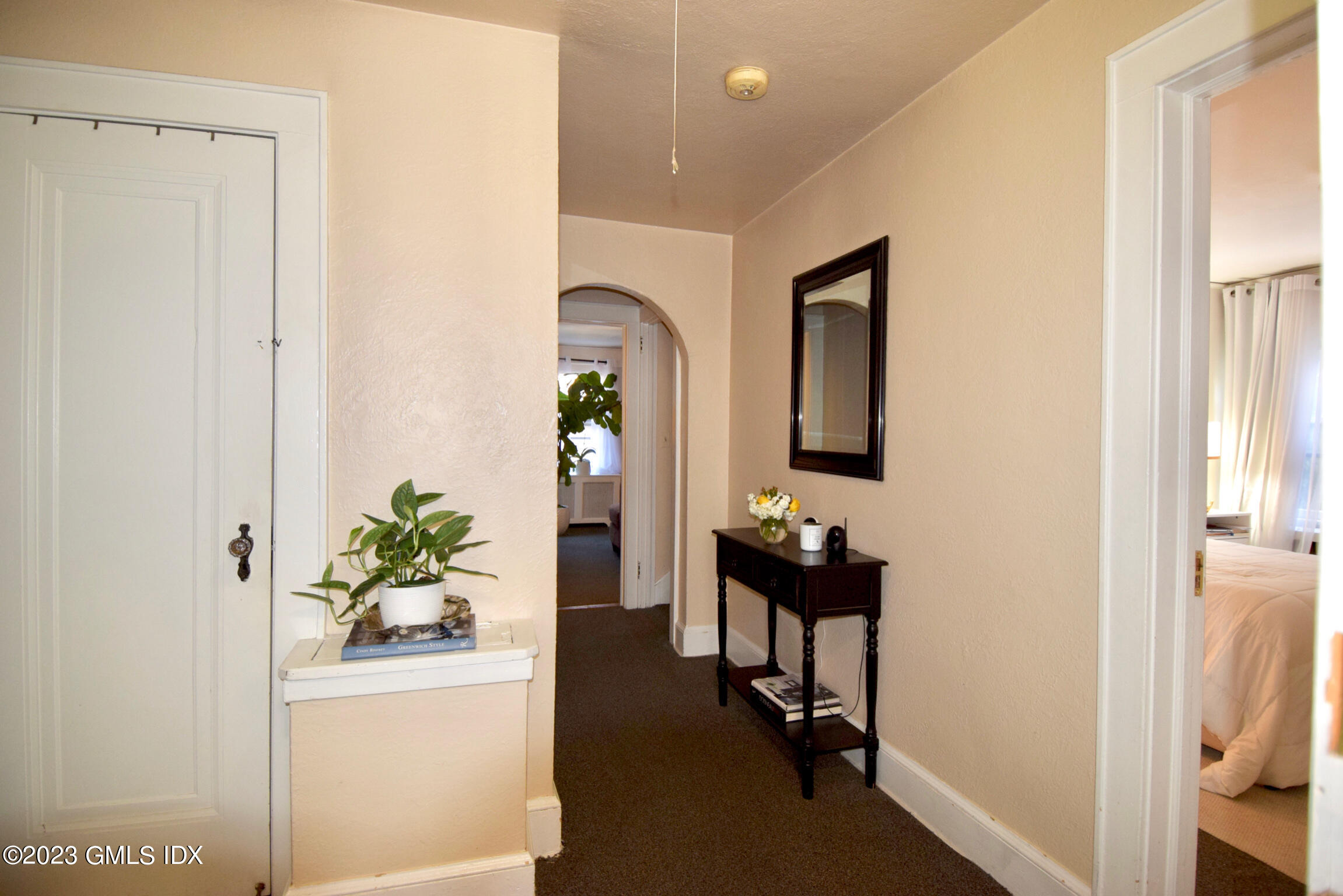 6 Pemberwick Road Greenwich, CT 06831 - Photo 15 of 32 a room with painting on the wall and a table