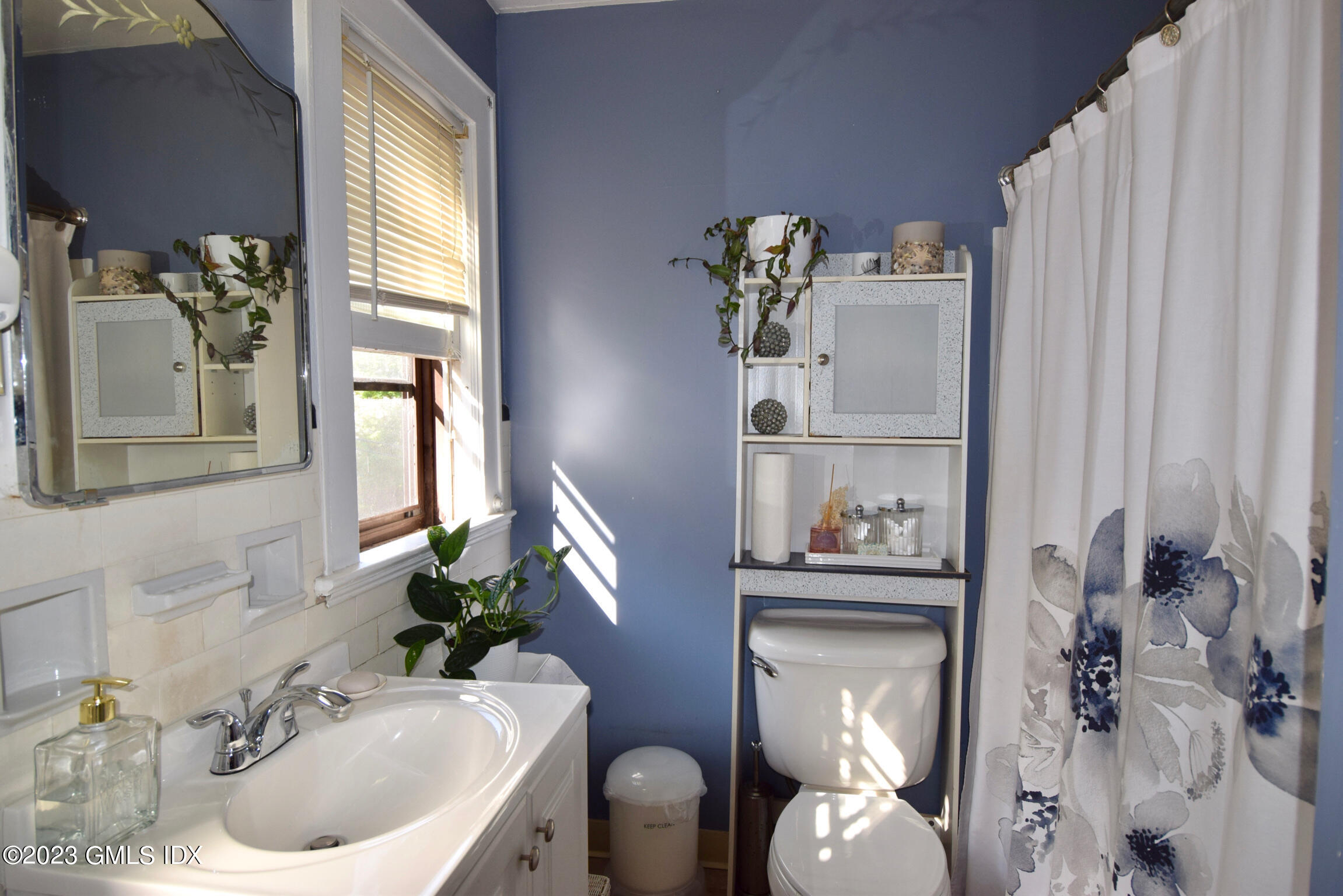 6 Pemberwick Road Greenwich, CT 06831 - Photo 17 of 32 a bathroom with a sink and a mirror