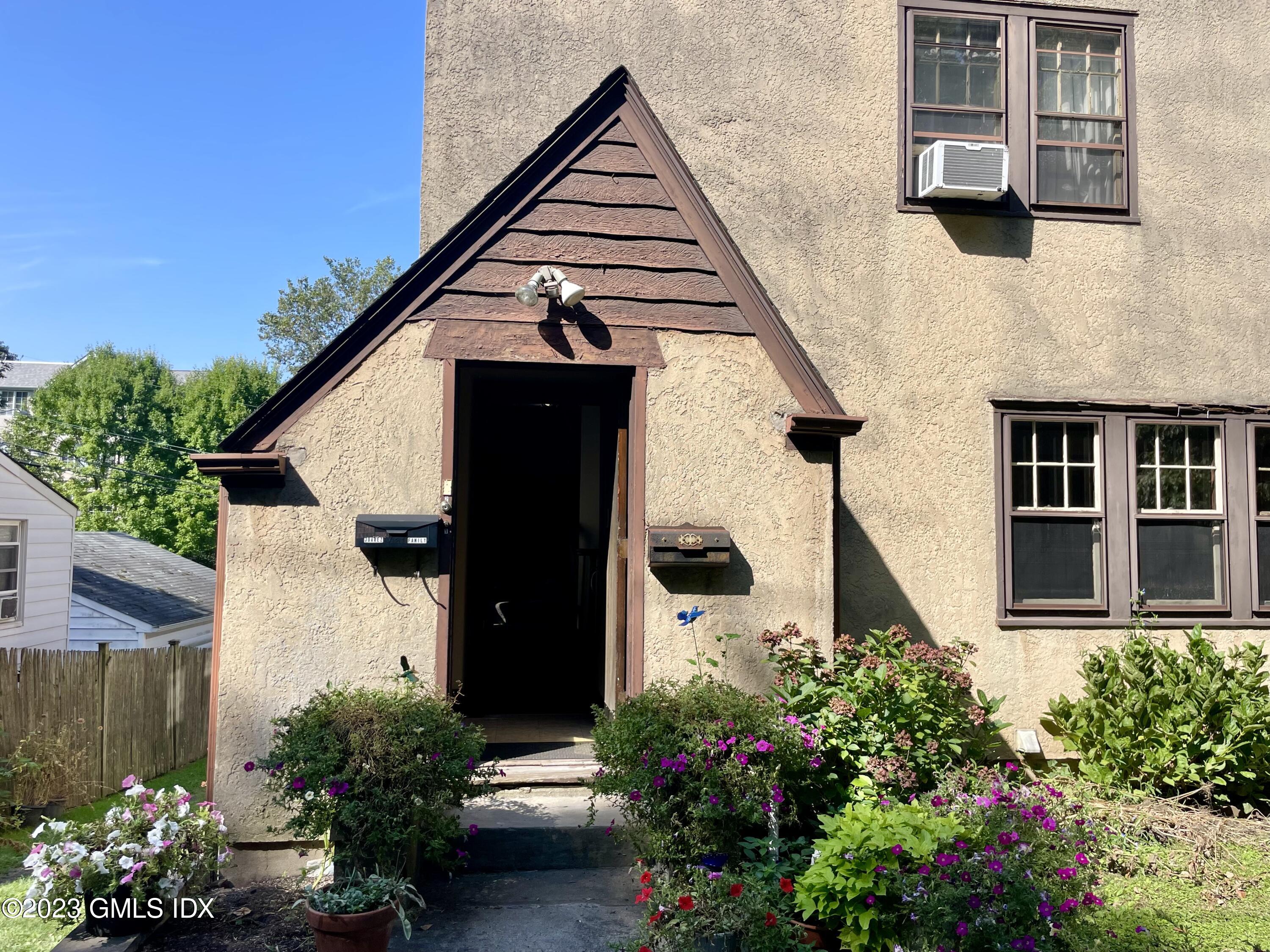 6 Pemberwick Road Greenwich, CT 06831 - Photo 2 of 32 front view of a house with a yard