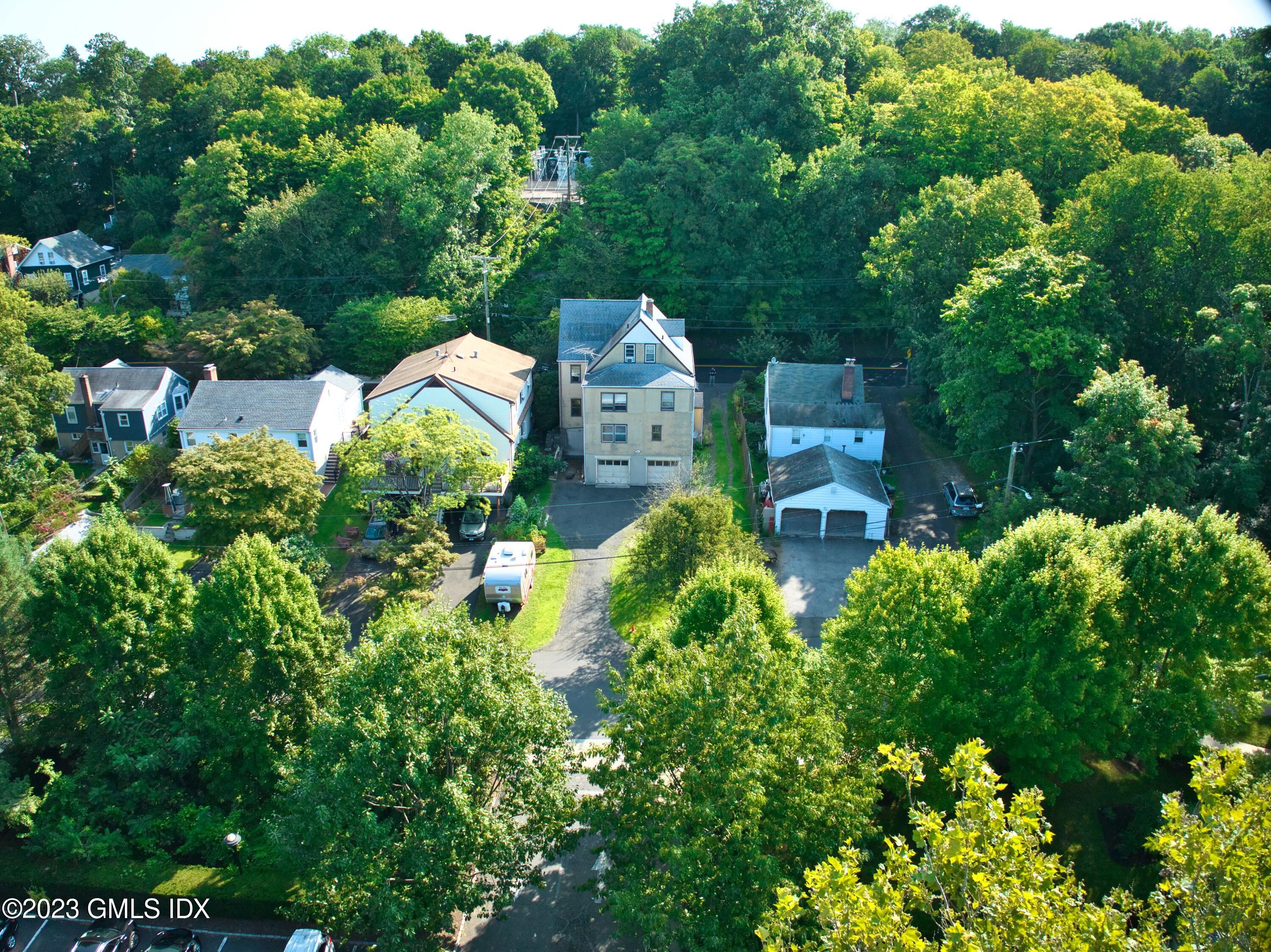 6 Pemberwick Road Greenwich, CT 06831 - Photo 28 of 32 an aerial view of a house with a yard and garden