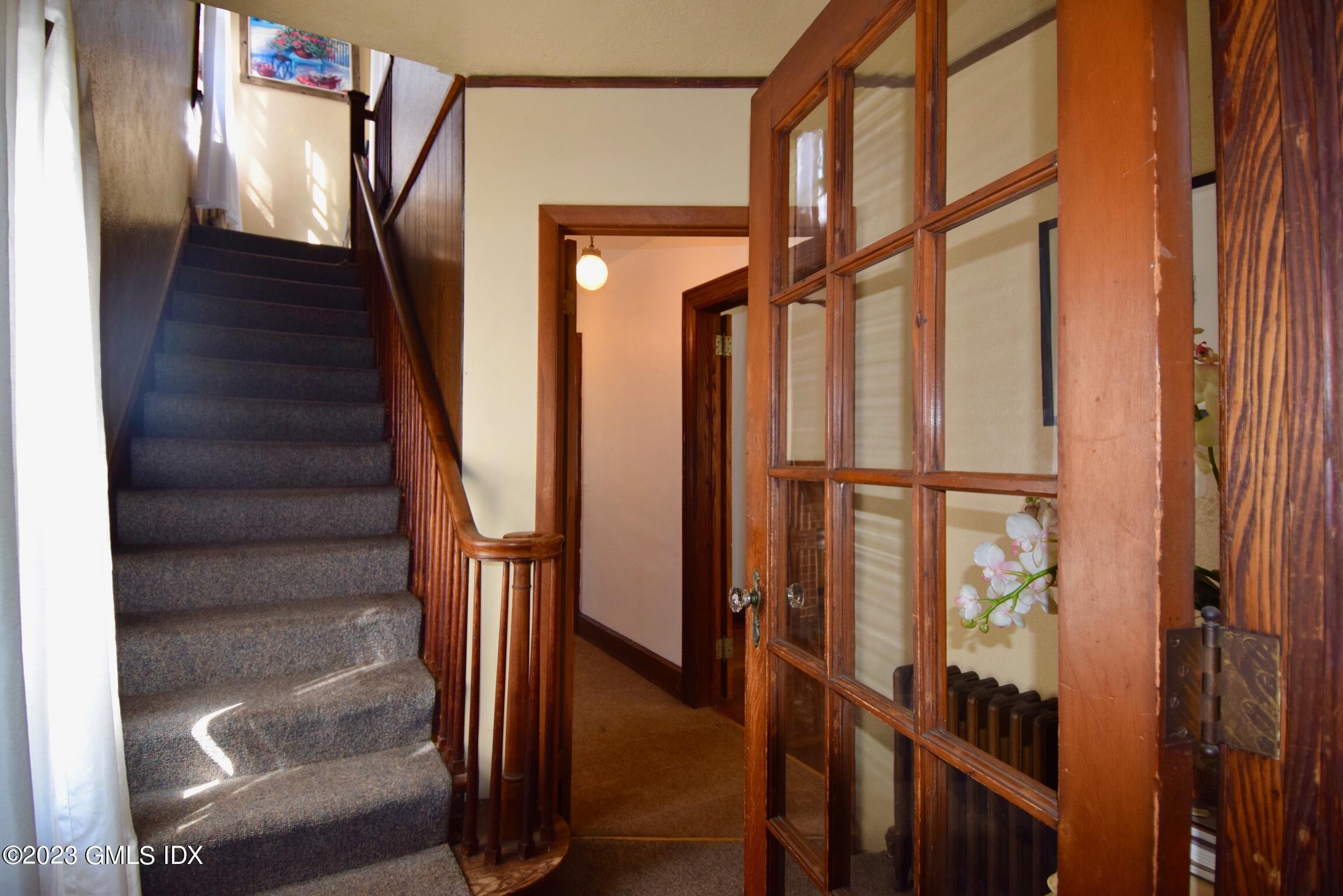 6 Pemberwick Road Greenwich, CT 06831 - Photo 3 of 32 a view of staircase with wooden floor and stairs
