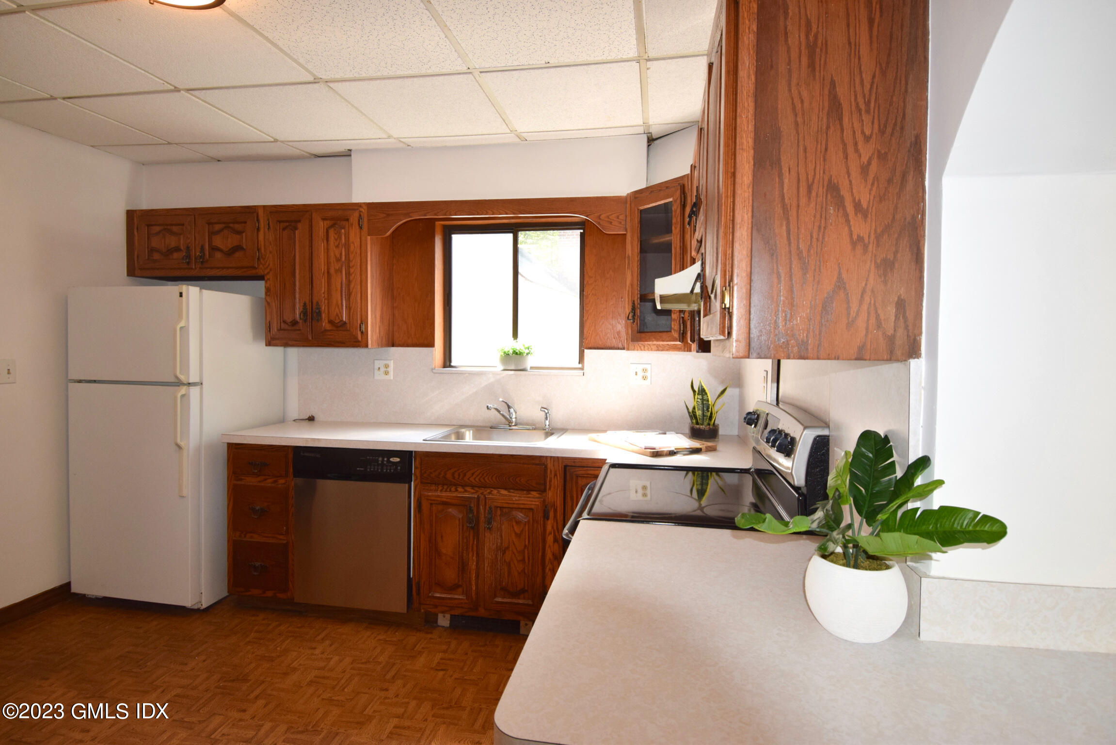 6 Pemberwick Road Greenwich, CT 06831 - Photo 6 of 32 a kitchen with a sink refrigerator and cabinets