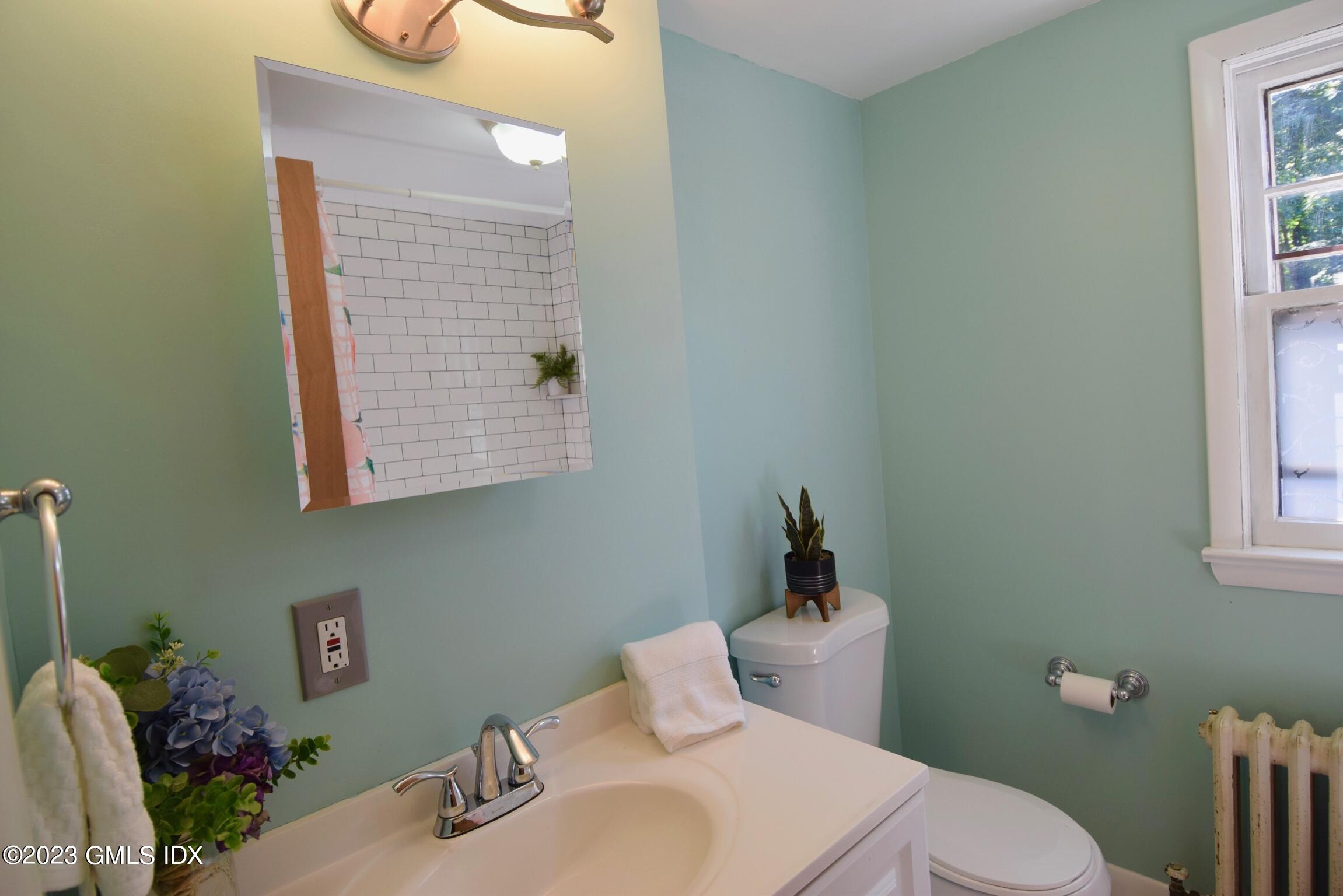 6 Pemberwick Road Greenwich, CT 06831 - Photo 8 of 32 a bathroom with a sink mirror and toilet