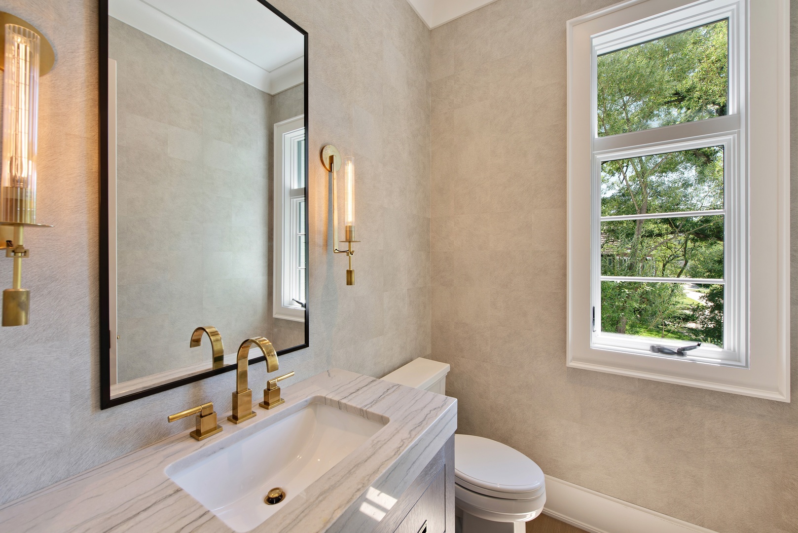 854 Bluff Street Glencoe, IL 60022 - Photo 15 of 37 a bathroom with a sink a toilet and a mirror