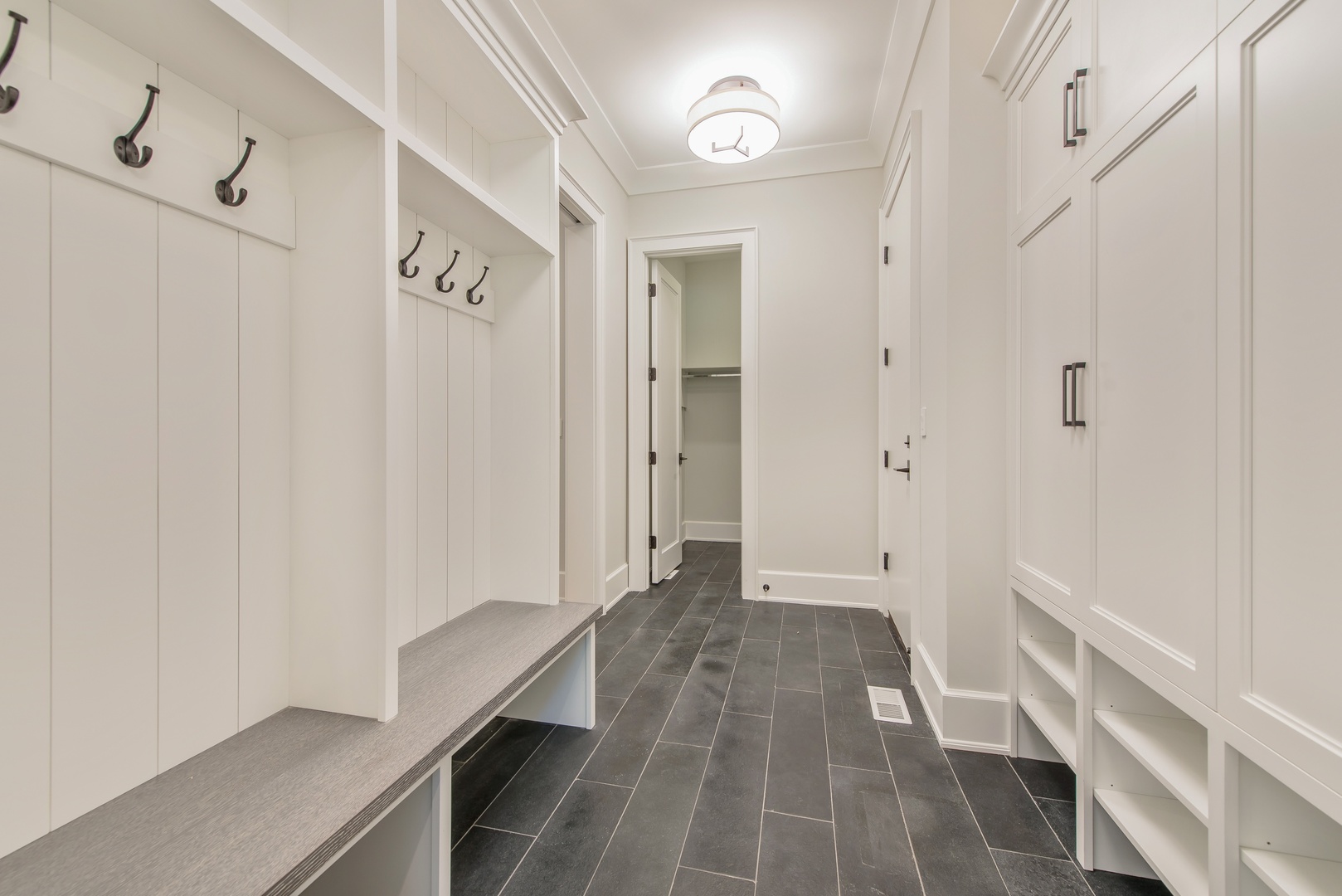 854 Bluff Street Glencoe, IL 60022 - Photo 16 of 37 a view of a hallway with wooden floor and entryway