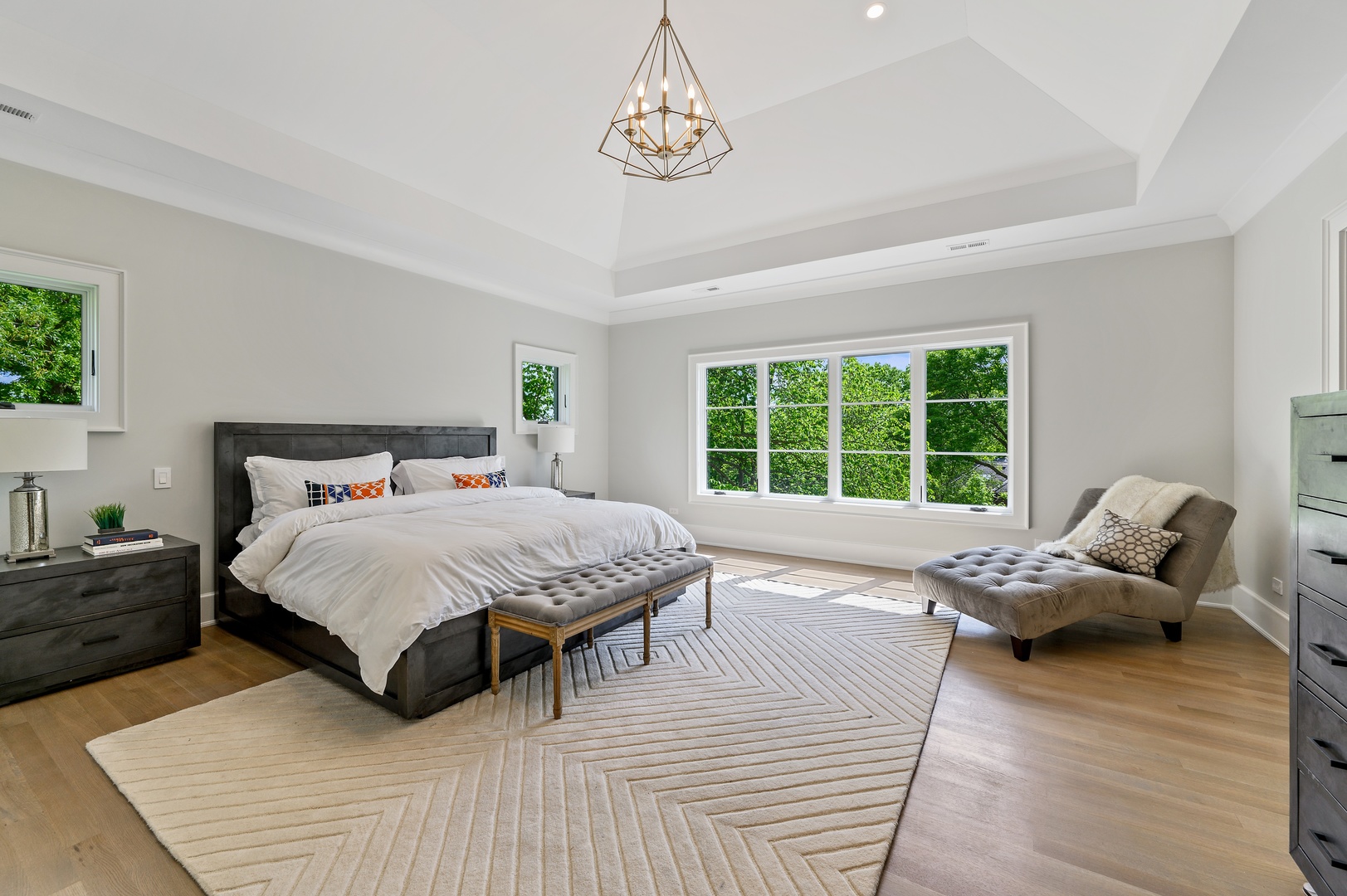 854 Bluff Street Glencoe, IL 60022 - Photo 18 of 37 a bedroom with a bed and wooden floor