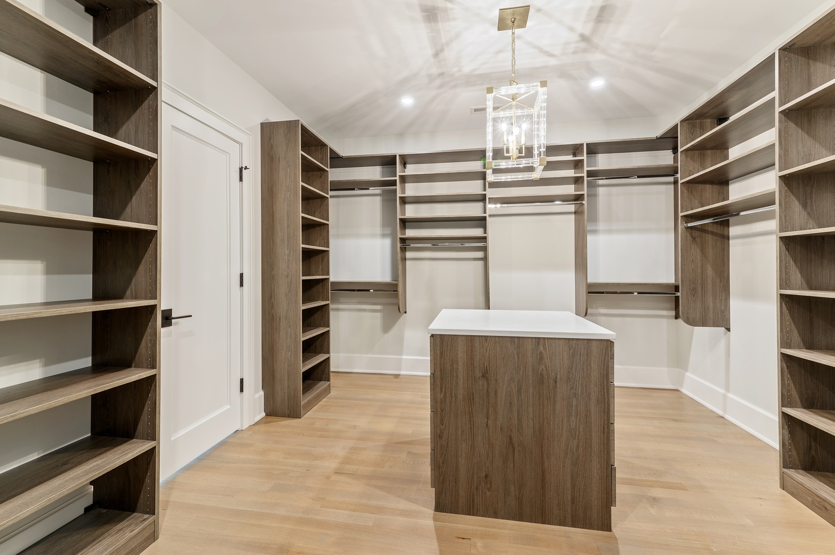 854 Bluff Street Glencoe, IL 60022 - Photo 21 of 37 a view of a living room a walk in closet and wooden floor