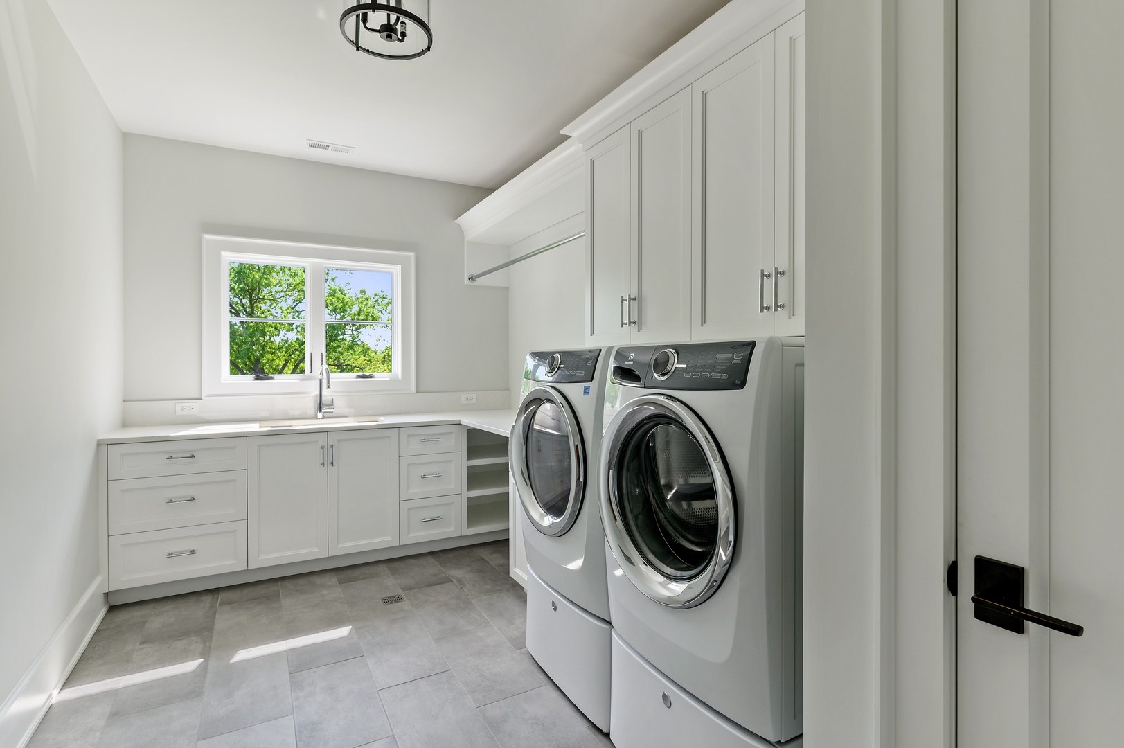 854 Bluff Street Glencoe, IL 60022 - Photo 22 of 37 a utility room with sink dryer and washer