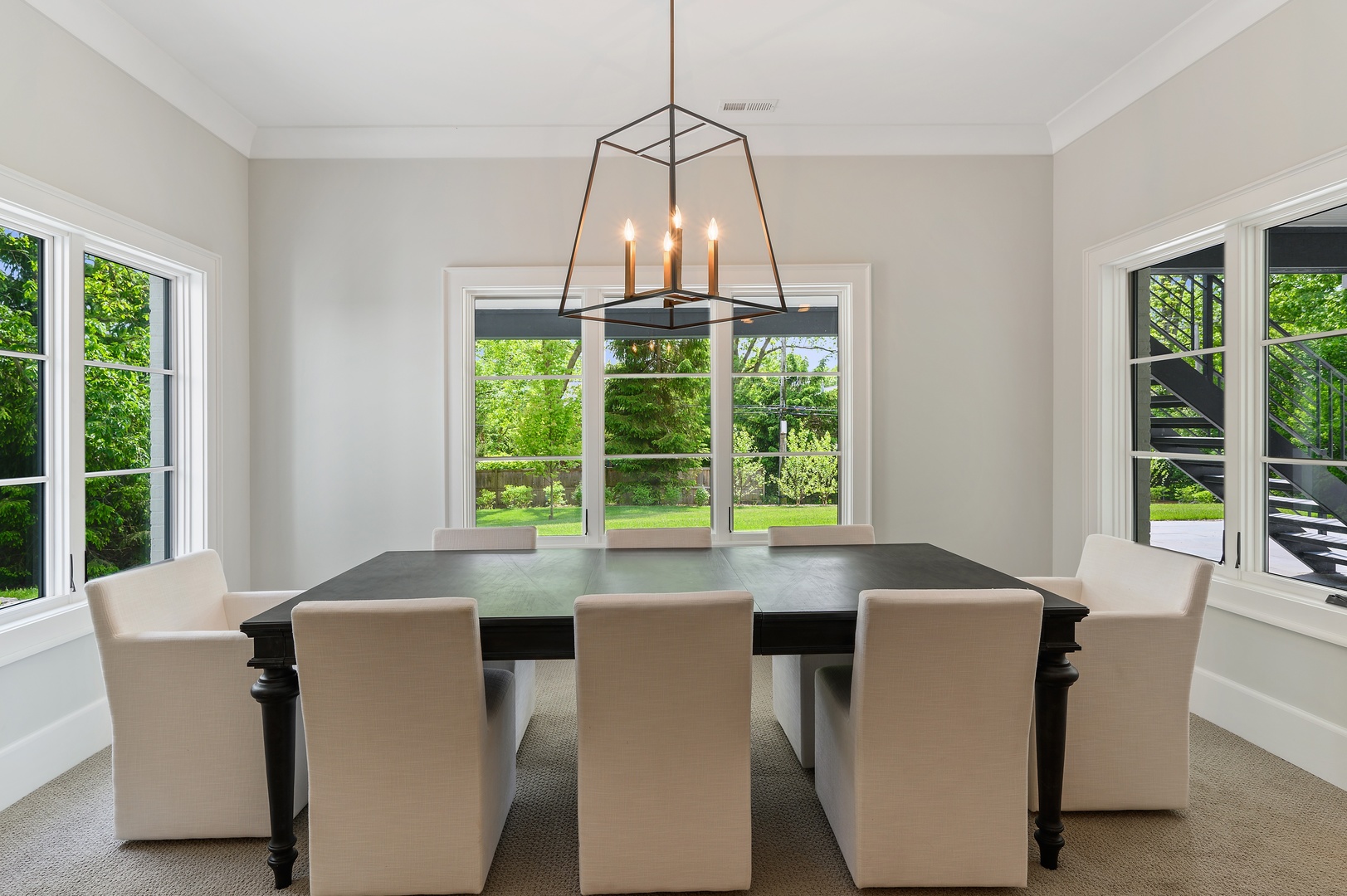 854 Bluff Street Glencoe, IL 60022 - Photo 28 of 37 a dining room with furniture a chandelier and wooden floor