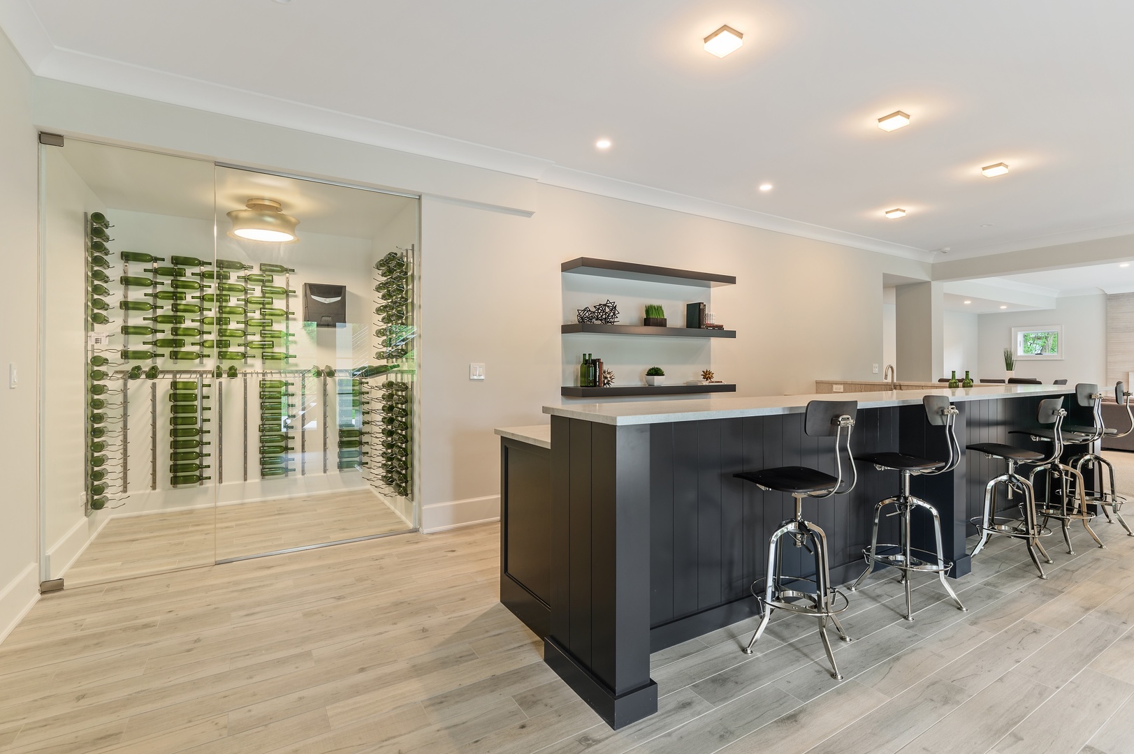 854 Bluff Street Glencoe, IL 60022 - Photo 30 of 37 a room with stainless steel appliances kitchen island granite countertop a refrigerator a stove and a dining table with wooden floor