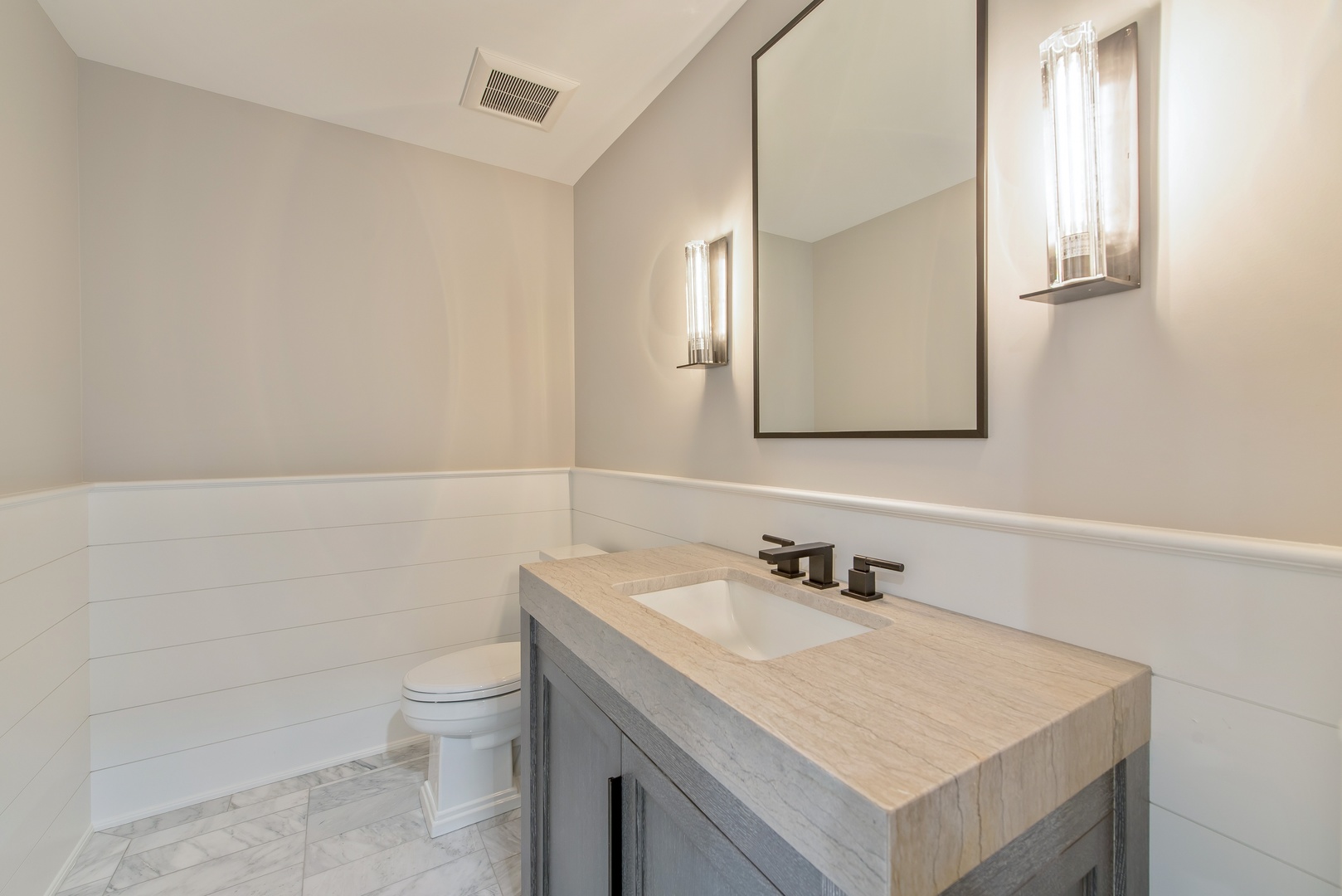 854 Bluff Street Glencoe, IL 60022 - Photo 32 of 37 a bathroom with a sink toilet and mirror