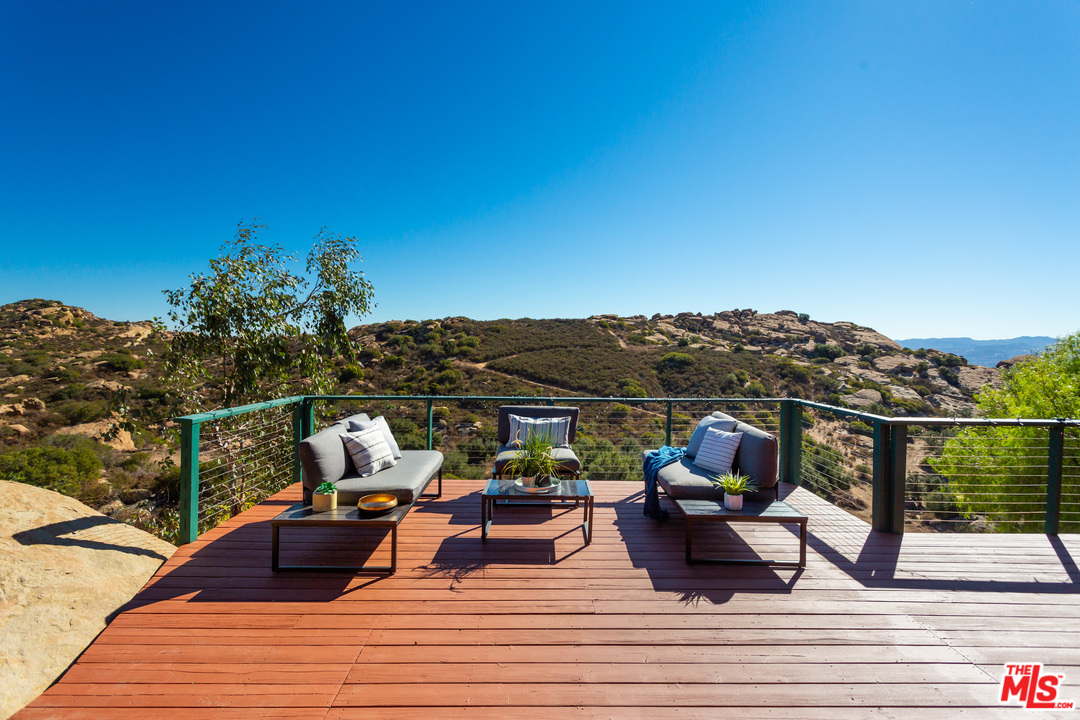 7429 Studio Road West Hills, CA 91304 - Photo 15 of 44 a view of a terrace with seating space