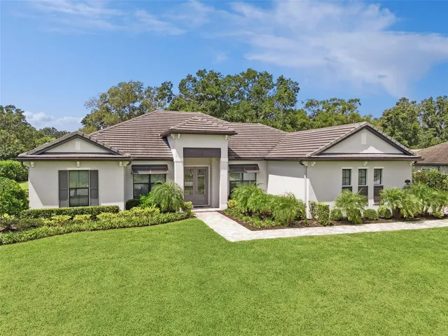 front view of a house with a yard