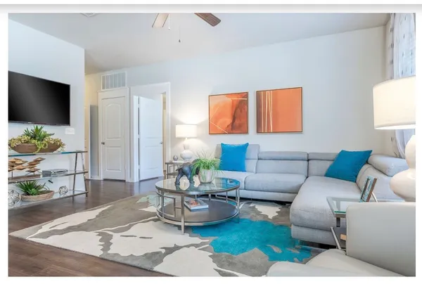 a living room with furniture and a flat screen tv