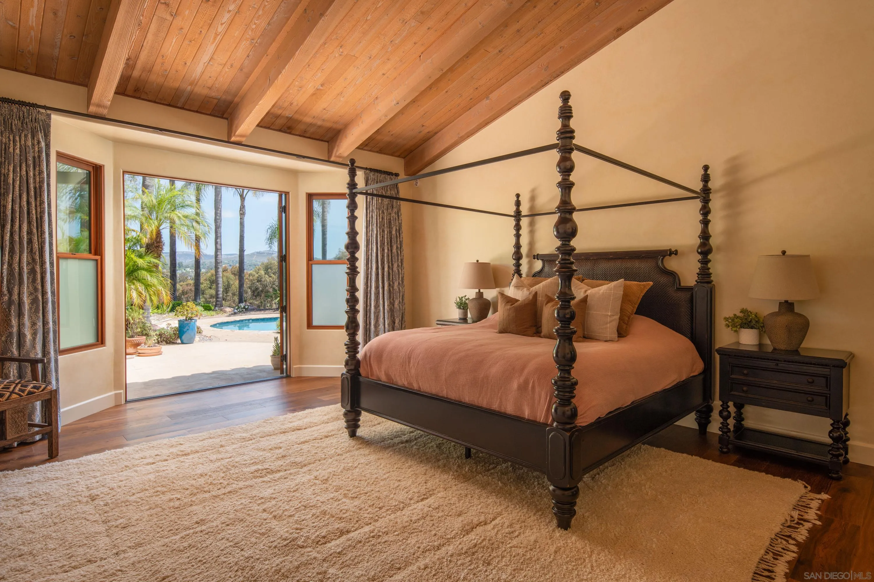 3028 Paseo Cielo Rancho Santa Fe, CA 92024 - Photo 17 of 50 a bed sitting in a spacious bedroom next to a window