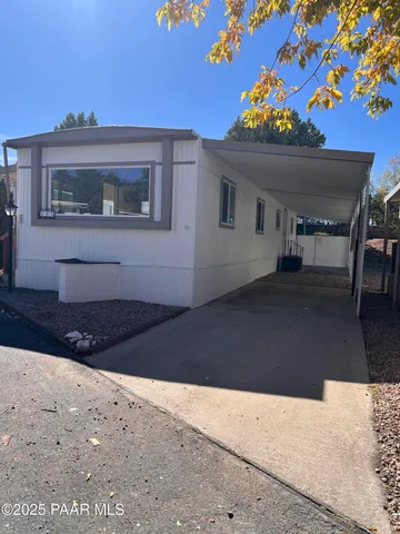 a living room with a couch and a rug