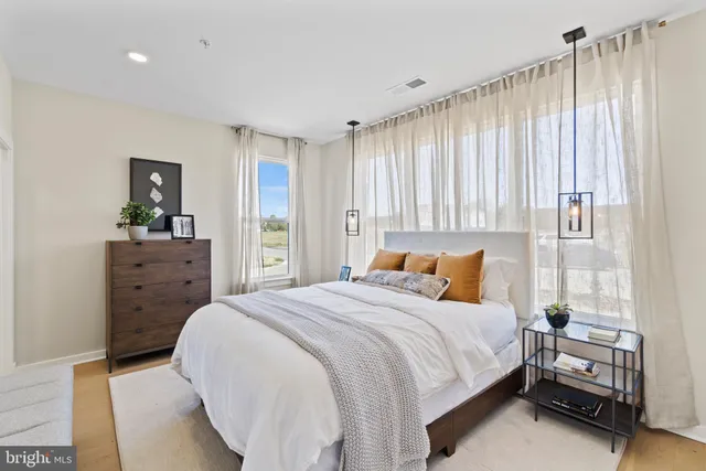 a bedroom with a bed and a dresser