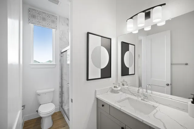 a bathroom with a sink vanity and a mirror