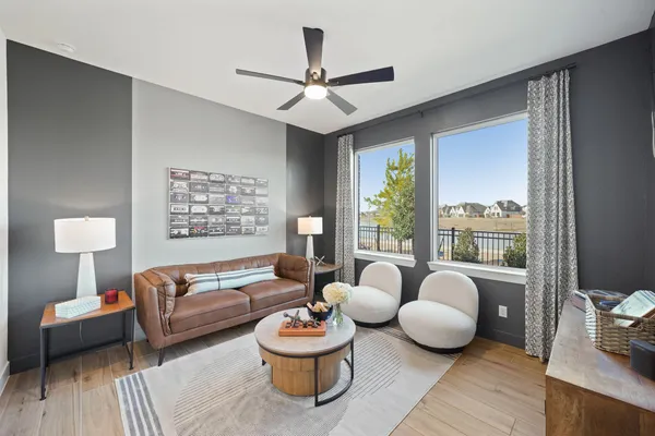 a living room with furniture and a large window