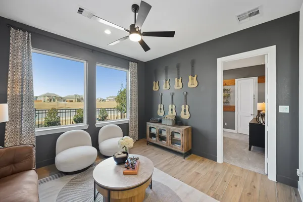 a living room with furniture and a large window