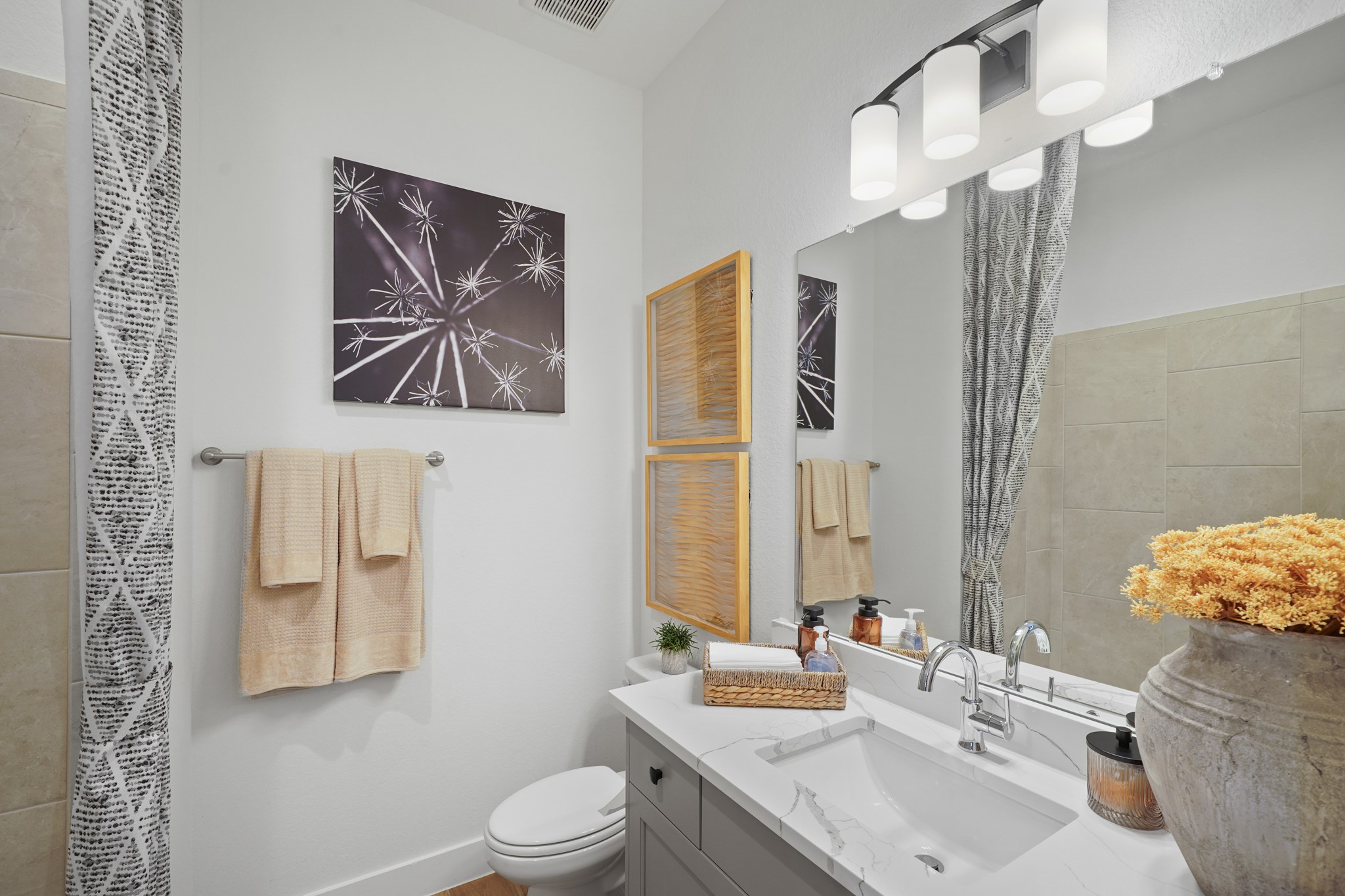 15743 Hoptree Hts Lane Conroe, TX 77302 - Photo 21 of 36 a bathroom with a sink a toilet and mirror