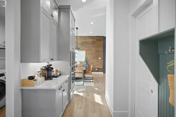a kitchen with stainless steel appliances a sink stove and cabinets