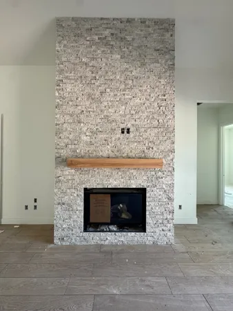 a living room with a fireplace