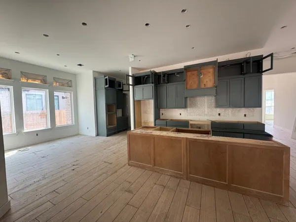 a kitchen with stainless steel appliances granite countertop a sink and cabinets